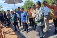 Kapolsek Matan  Hilir Selatan AKP Jumadi Hutabarat Hilir Selatan Pimpin Pengamanan Kunjungan Drs. H. Ria Norsan, M.M., M.H.