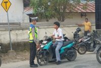 Aipda Hengki Laksanakan Ploting Point Pagi, Memastikan Keamanan dan Keselamatan Pengendara di Persimpangan