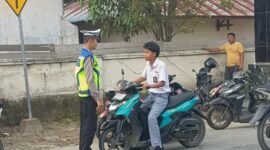 Aipda Hengki Laksanakan Ploting Point Pagi, Memastikan Keamanan dan Keselamatan Pengendara di Persimpangan